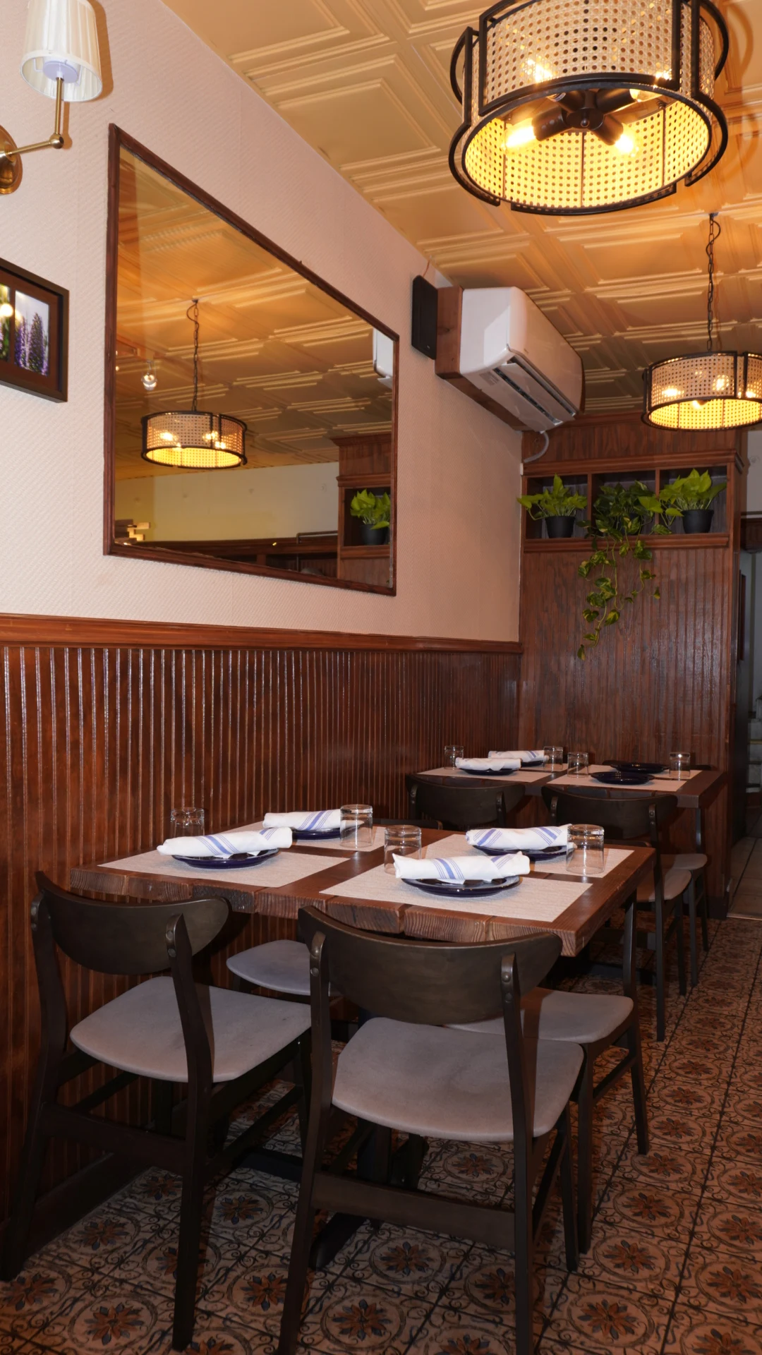 Alesta Interior - Intimate setting with warm wood tones and soft lighting