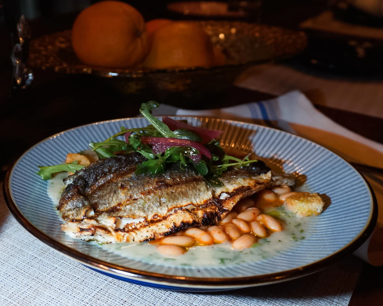 Branzino - Fasolada, velouté, croutons — golden skin, warm broth